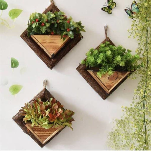 Blomsterkrukke I Træ På Væg